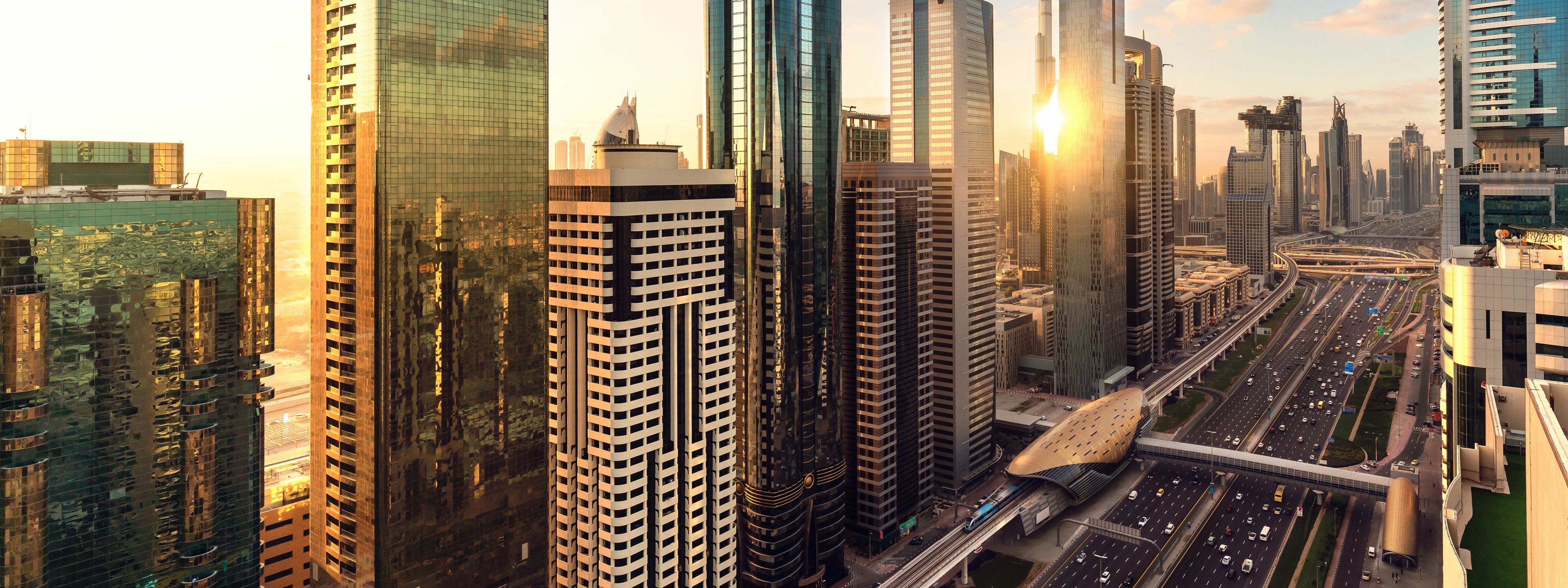 Golden hour view of residential skyscrapers on Sheikh Zayed Road
